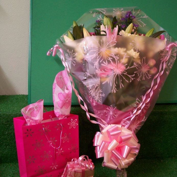 Bouquet of Flowers with a bag full of Treats 